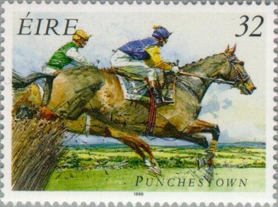 Timbre: Hippodrome de Punchestown, chevaux sautant une haie